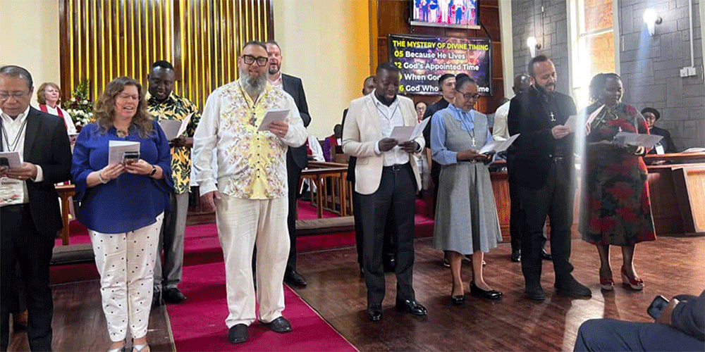 Newly commissioned missionaries in Nairobi, Kenya, recite the Wesleyan Covenant Prayer at Lavington United Church. (Photo: Susan Clark)