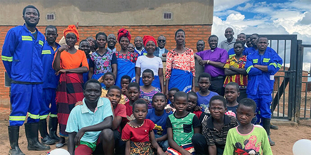 Bishop Gift K. Machinga stands with Mikundi Dairy Farm staff and members of the surrounding community after the farm’s dedication ceremony in November. The farm is seen as a highlight of the Malawi Provisional Annual Conference, which is rebounding after years of legal turmoil. Photo by Francis Nkhoma, UM News.