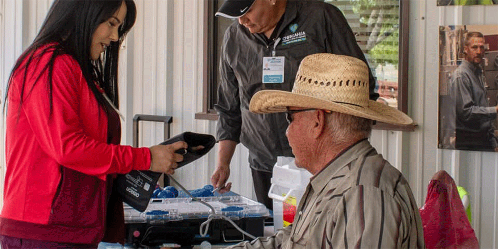Chiricahua Health Center Workers provide health screenings for workers at Curry Farms. Photo: Courtesy of Chiricahua Health Centers