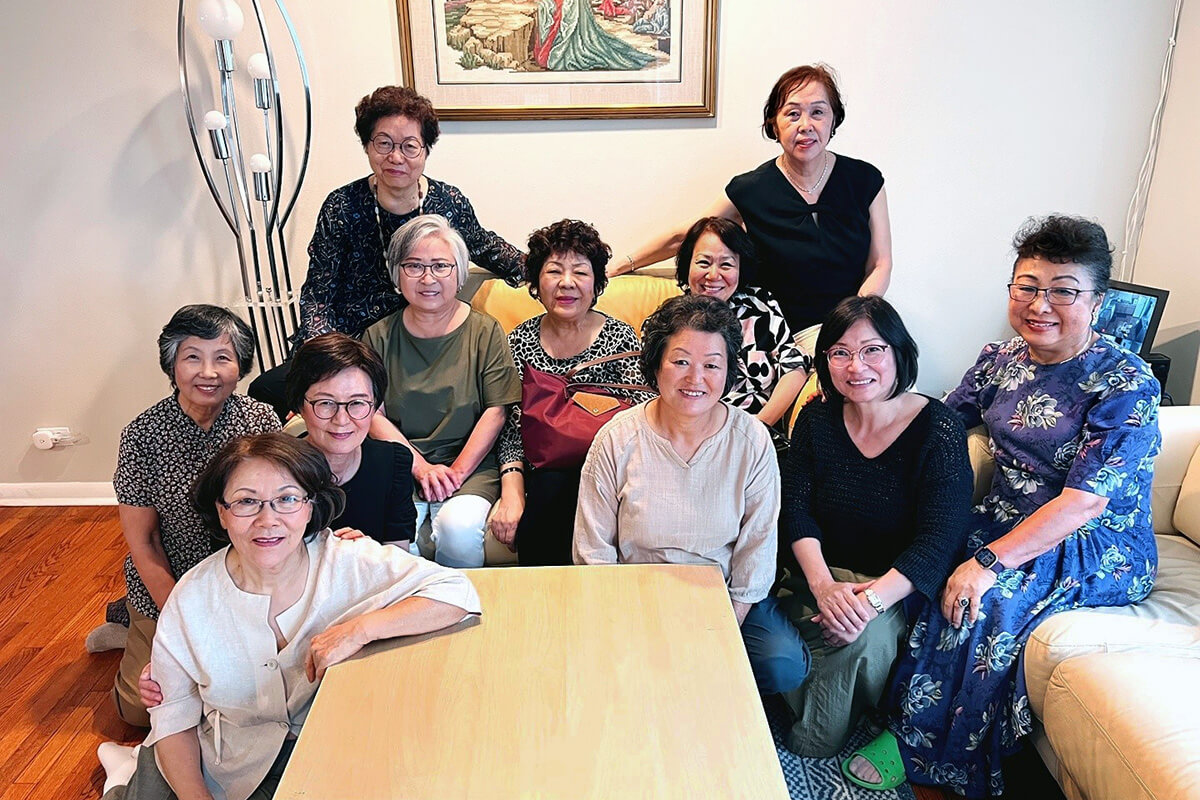  Representatives of churches in the Chicago area who are supporting Sammool House meet in the living room of the home, which provides a safe place for women escaping domestic conflict, financial hardship or other crises. The ministry was founded by the Rev. Misook Park (third from left), pastor of Sammool Korean United Methodist Church in the Northern Illinois Conference. Photo courtesy of Sammool House. 